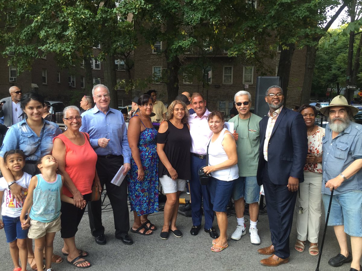 Assemblyman Dinowitz, Senator Klein, and Bronx Council on the Arts Representative Tony Holmes took a photo with some of the residents who were very excited about a concert just outside their homes in Van Cortlandt Village's Train Park.