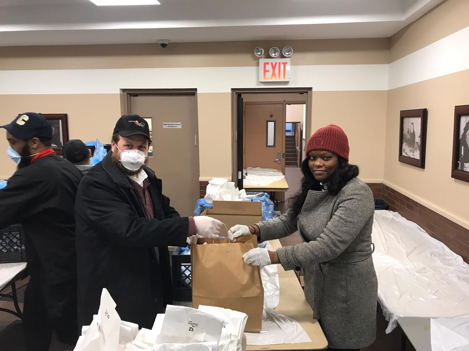 Assemblymember Bichotte with Dovi Zeitland Preparing grab and go bags for community members on March 26, 2020.