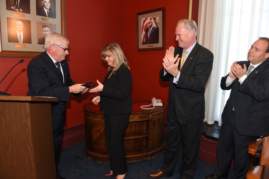 Assembly Minority Leader Brian M. Kolb (R,C-Canandaigua) and Assemblymen Michael Fitzpatrick (R,C,I-Smithtown) and Phil Palmesano (R,C,I-Corning) present Kathy Albrecht with the New York State Gift of