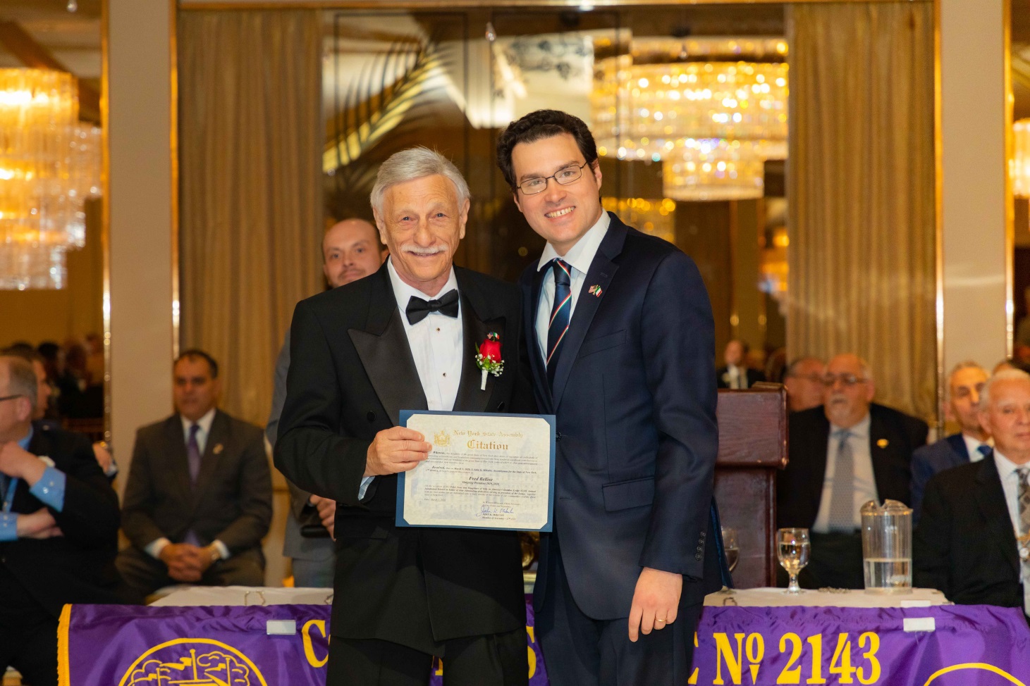 Assemblyman John Mikulin (R,C,I-Bethpage) presents Fred Bellise, outgoing president of the Sons of Italy Columbus Lodge 2143, with a citation at their installation ceremony on Sunday, March 1 at the R