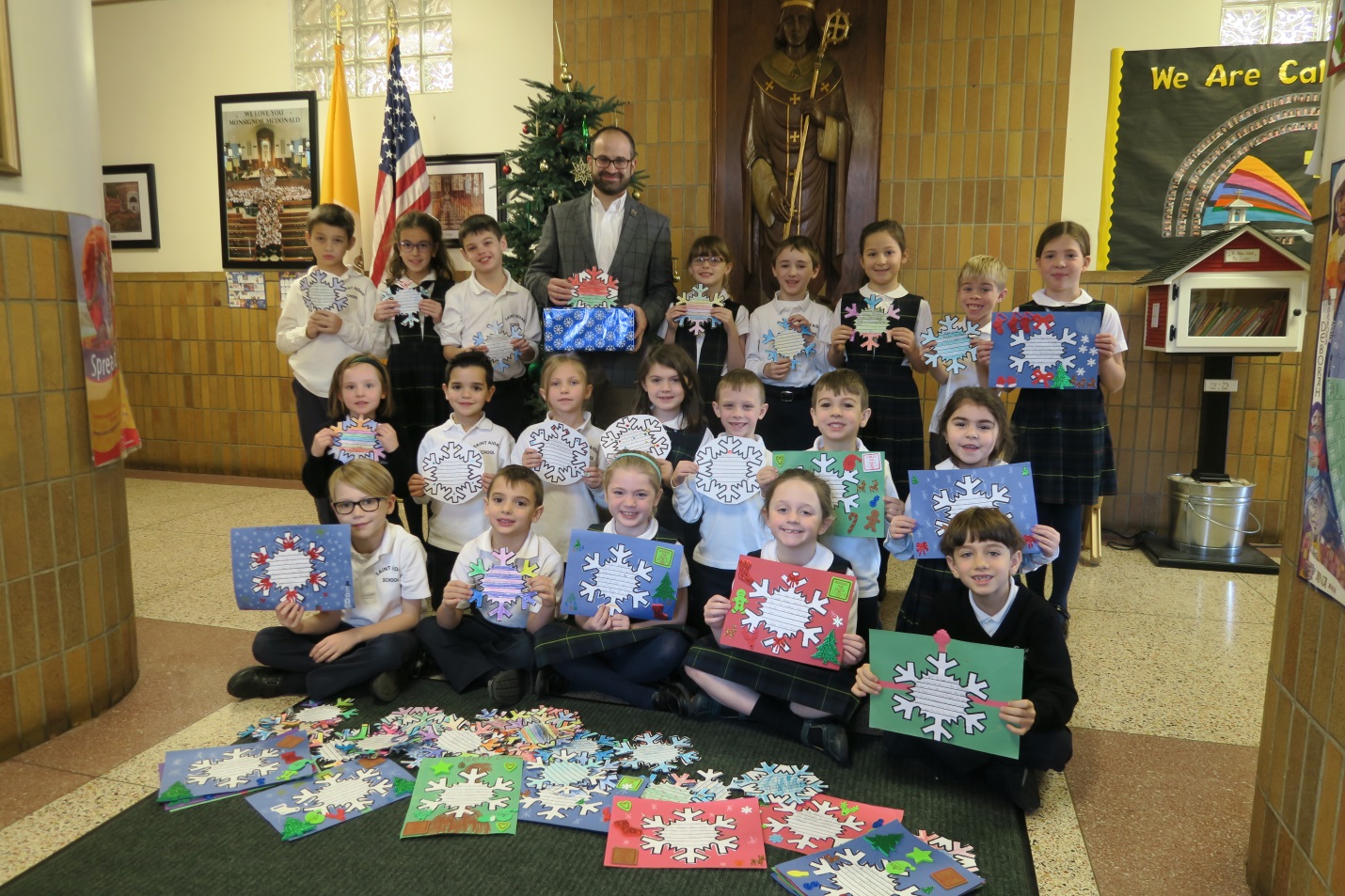 Assemblyman Ed Ra (R-Franklin Square) with students from St. Aidan’s lower school who participated in his annual Snowflakes for Seniors program to spread holiday cheer to local senior citizens.