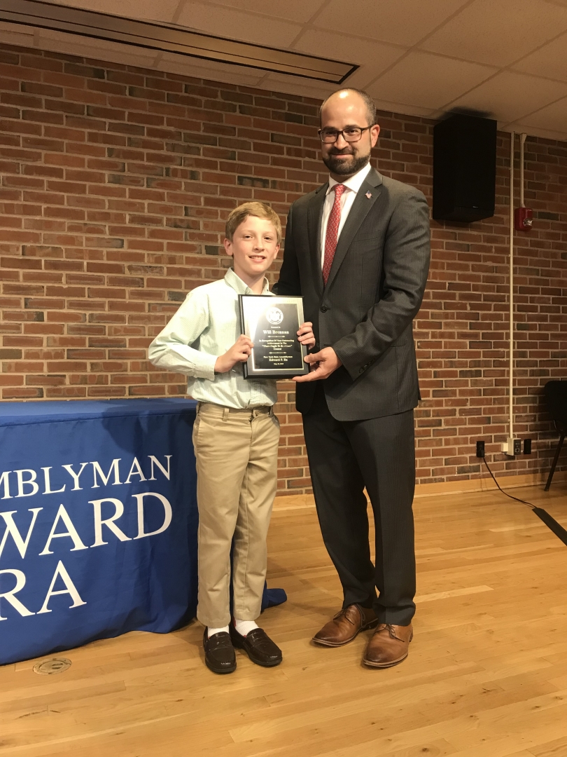 Assemblyman Ed Ra (R,C,I-Franklin Square) pictured with contest winner Will Brennan from Stratford Avenue School in Garden City. The second photo features Ra, Brennan and Karen Cummings from LiveOnNY.