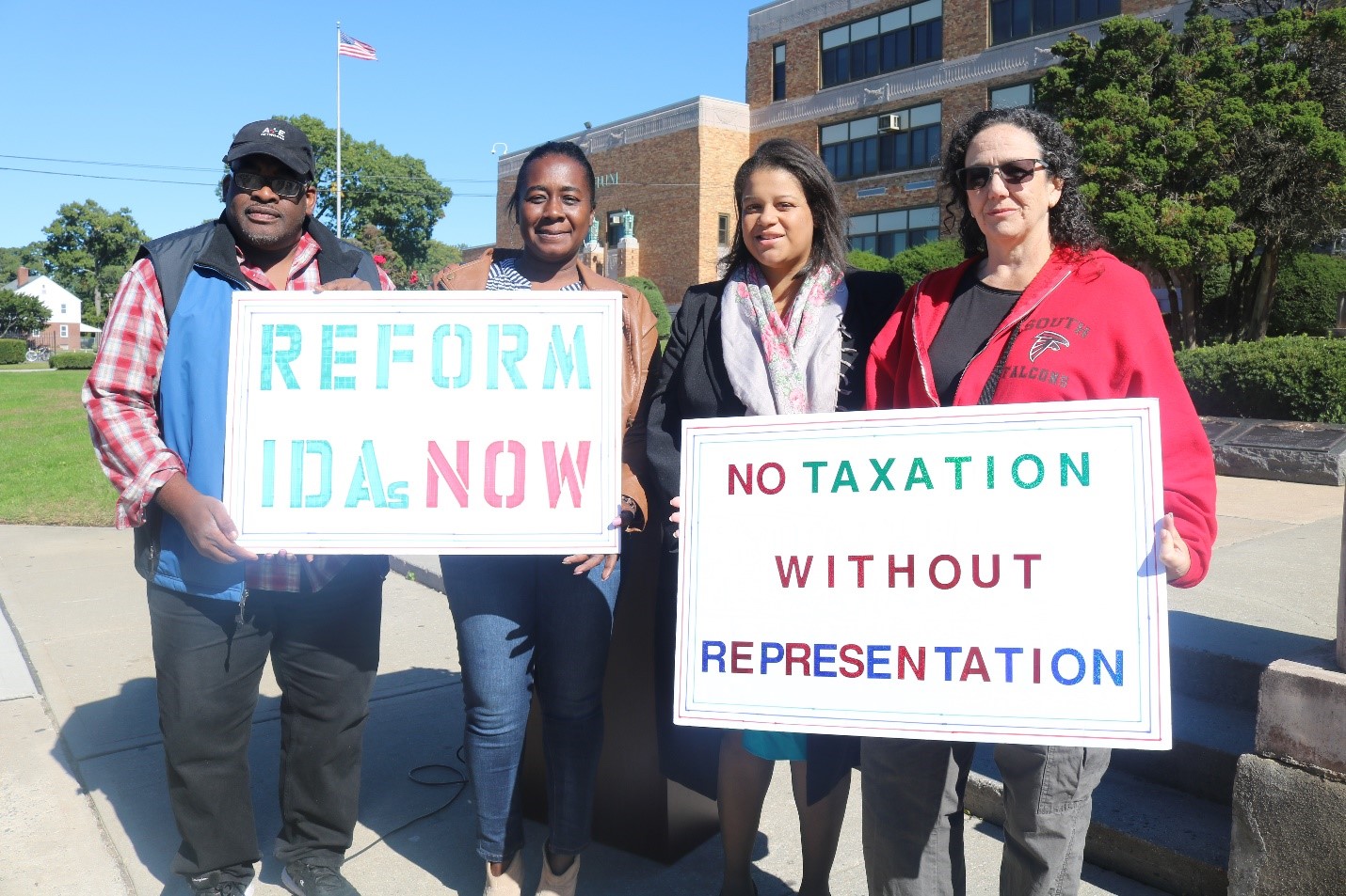 Community members rally with Assemblywoman Solages for IDA reform after the Green Acres tax break fiasco.