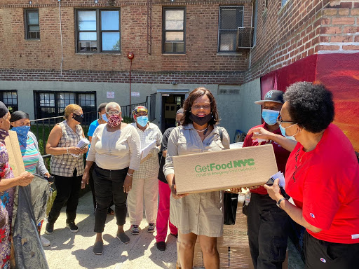 Assemblymember Rodneyse Bichotte and other community members gather together for a food distribution at the Flatbush Garden Community Center June 12, 2020.