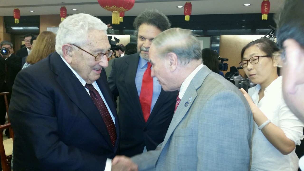 Assemblymembers William Colton and Felix Ortiz meeting with former Secretary of State Henry Kissinger.