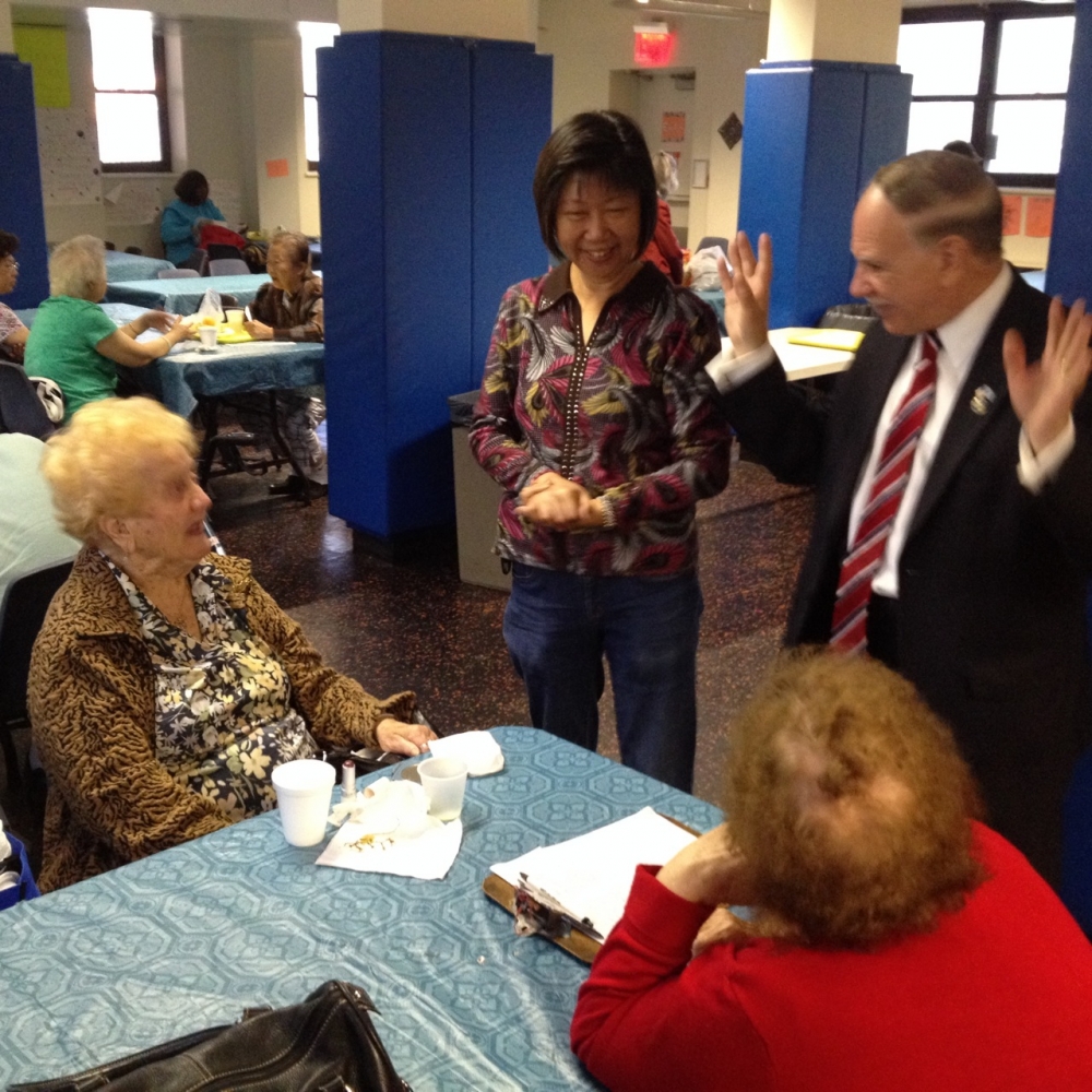 Assemblymember William Colton and community relations Director Nancy Tong with seniors at Marlboro Senior Center.