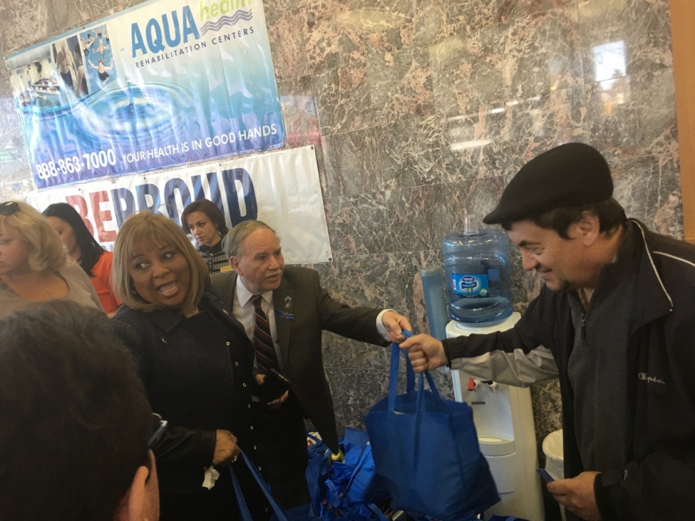 Assemblymembers William Colton and Pamela Harris at a Passover food giveaway sponsored by Be Proud Foundation.