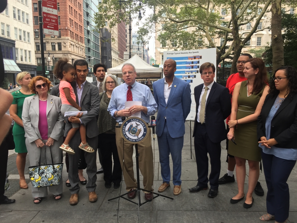 Assemblyman Jeffrey Dinowitz, Chair of the Assembly Committee on Corporations, Authorities, and Commissions, pictured here with fellow city and state elected officials as well as transit advocates at