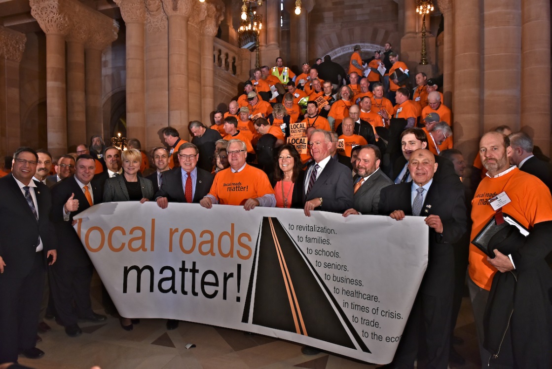 Assemblyman Karl Brabenec (R,C,I-Deerpark) [second from left] fights for local infrastructure funding at an Albany rally on Wednesday, March 6.