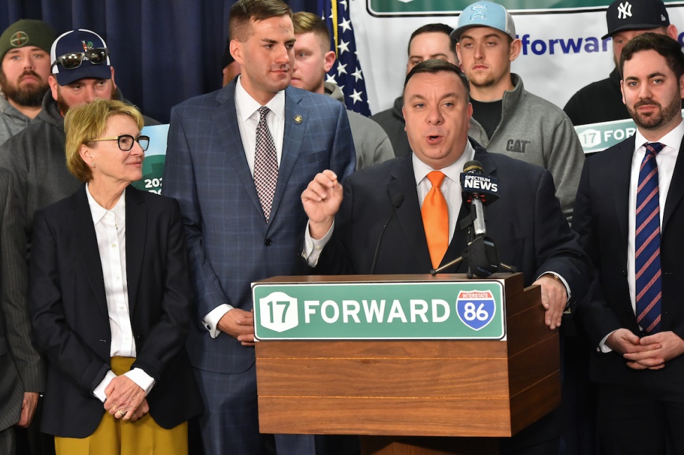 Assemblyman Karl Brabenec (R,C,I-Deerpark) [at podium] speaks at a press conference Wednesday, March 6 in Albany pushing for an expansion of Route 17 to Interstate 86