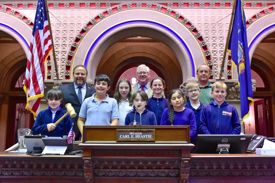 Assemblyman Palmesano, Senator O’Mara and teacher Keith Prather join the students on the rostrum in the Assembly Chamber.