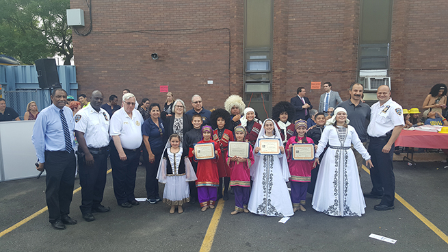 During their Annual National Night Out Celebration, Captain Gil Faisson of the 61st Precinct and Assemblywoman Weinstein posed with members of a local dance troupe who wowed the crowd.