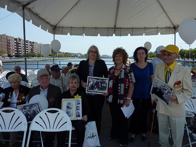 Assemblywoman Weinstein posed with surviving relatives, and lit candles in memory, of Holocaust survivors during a somber ceremony at Holocaust Memorial Park.
