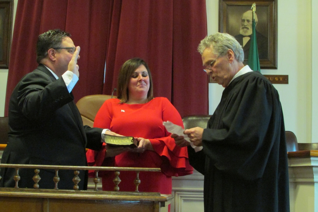 Assemblyman Brian Manktelow takes the oath of office on Jan. 1, 2019. His wife, Crystal, holds the family Bible as Lyons Town Justice Larry Hartwell swears him in.