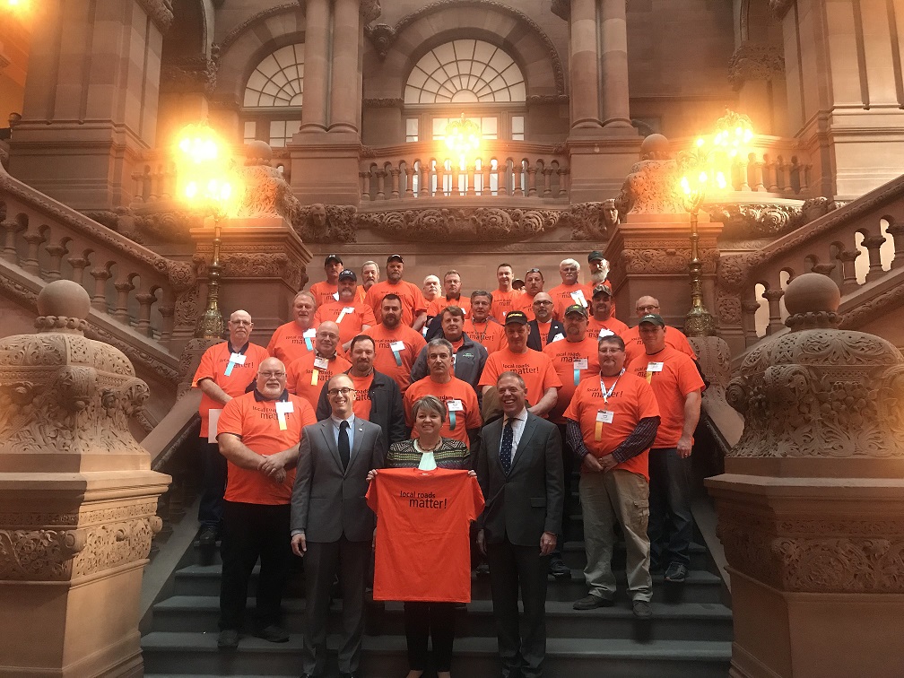 Assemblyman Will Barclay (R,C,I,Ref-Pulaski) stands with Senator Patty Ritchie (R-C-I--Ogdensburg) and Assemblyman Mark Walczyk (R,C,I,Ref—Watertown) alongside local highway superintendents at the CHIPS rally held today in the State Capitol.