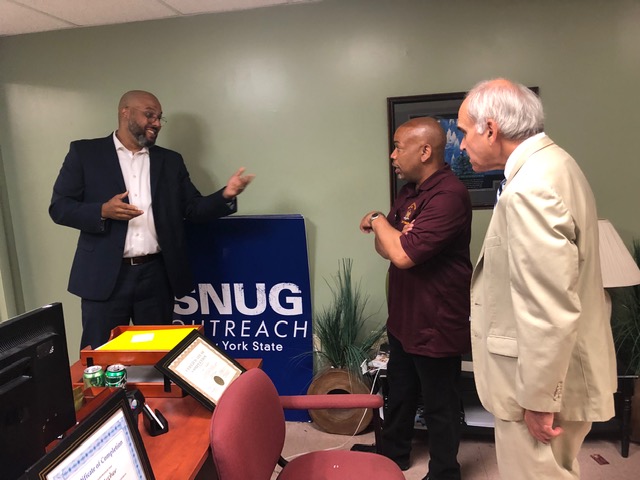 Pictured with Speaker Heastie in photo at the Family Partnership Center (left to right): SNUG Program Coordinator Danny Hairston and Assemblymember Jonathan Jacobson.