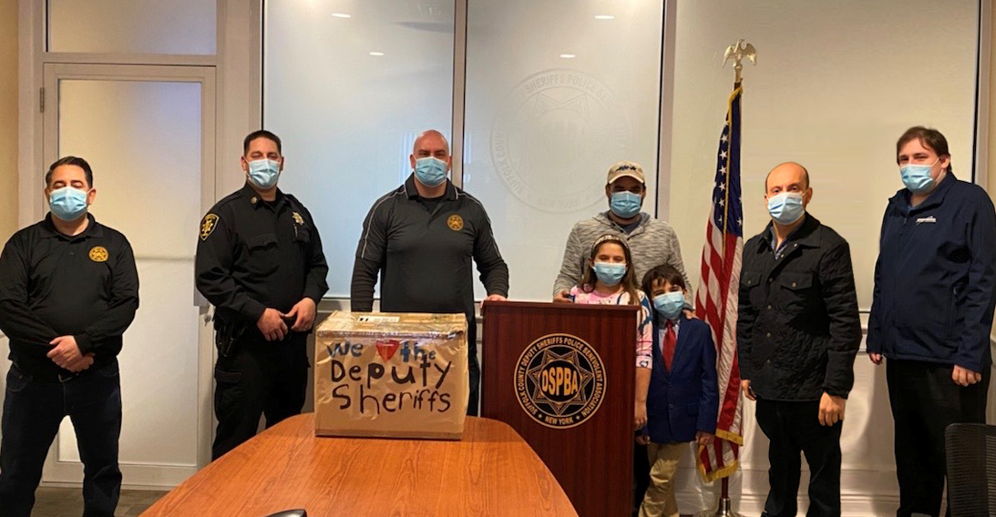 Yesterday New York State Assemblymen Doug Smith (R-Holbrook) and Andrew Garbarino (R-Sayville) joined Suffolk County Deputy Sheriffs PBA President John Becker and Vice President Artie Sanchez to accept a generous donation of 500 KN95 masks made by Jim Cot