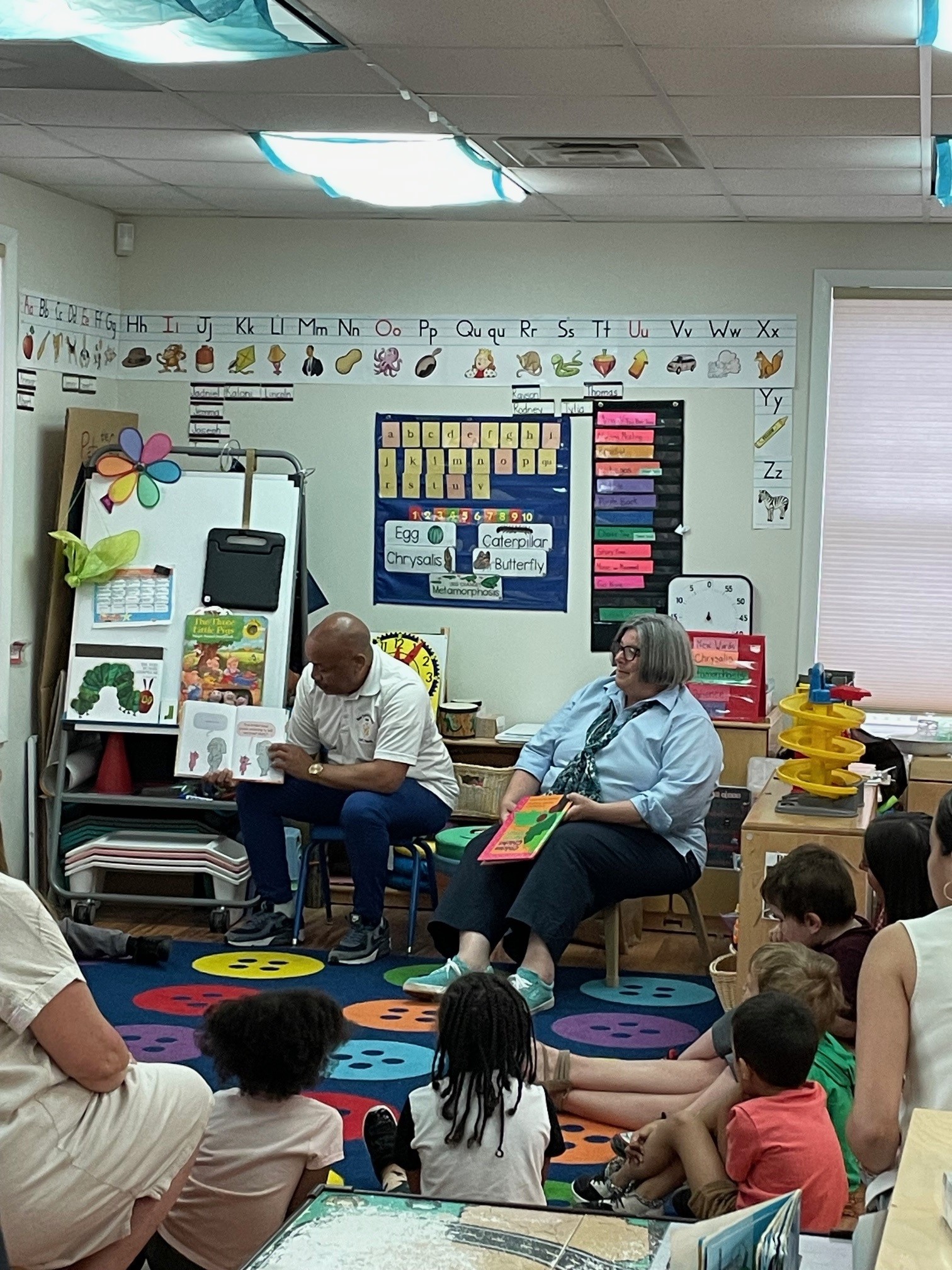 Pictured is Speaker Carl Heastie and Assemblymember Carrie Woerner reading books to students at the Jefferson Terrace Head Start Program in Saratoga County.